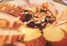 Warm Brie with Cranberries, Almonds, Caramelized Onions