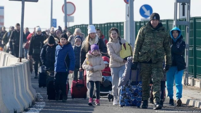 Ukrainian_refugees_from_2022,_crossing_into_Poland Ukrainians urge military, humanitarian aid; mull political impact of war
