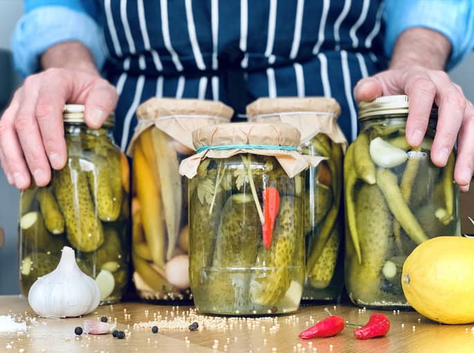 Man is doing cucumber pickles Penn State Extension to offer food-preservation webinars