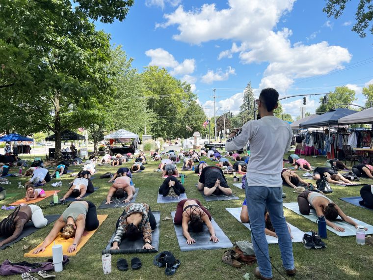 ‘Yoga on the Green’ returns to Canfield Sunday, Aug. 10. Studio Oxygen master instructor Travis Pownell leads a group yoga session from a previous year. (Studio Oxygen)